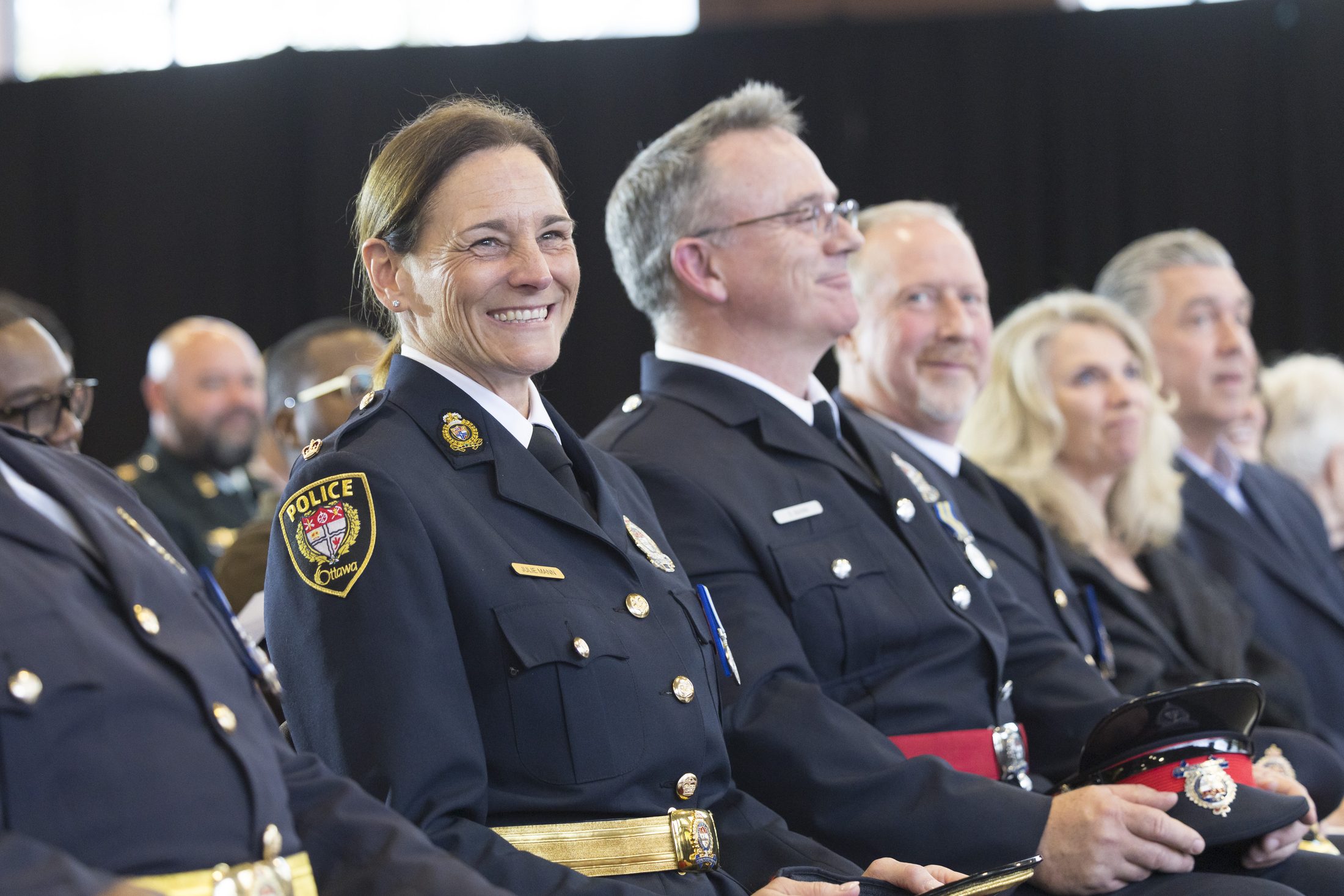 Senior officers of the Ottawa Police Service seated at a ceremonial gathering.